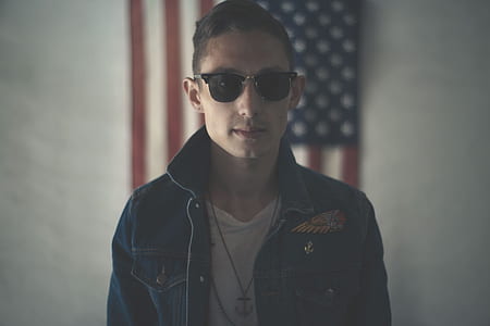 black in white crew-neck shirt with blue denim button-up jacket focus photograpjy thumbnail