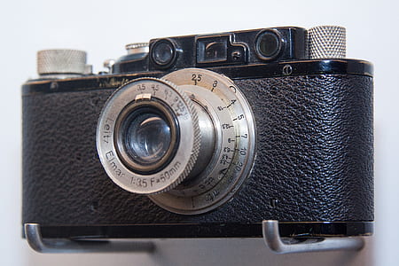 black SLR camera on grey stand thumbnail