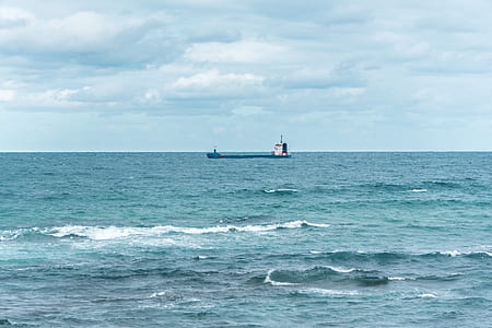 white and blue ship on sea thumbnail