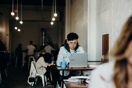 boy surfing on laptop inside cafe thumbnail