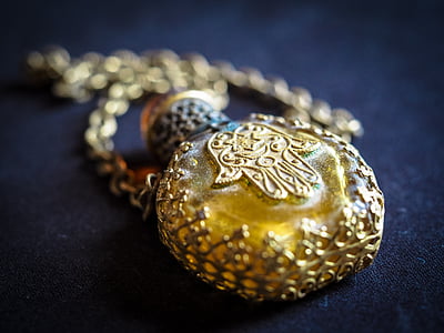 shallow focus photography of hamsa hand engraved pendant thumbnail