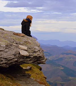 woman sitting on cliff thumbnail