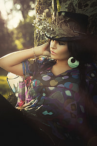 woman wearing black and yellow mesh v-neck shirt and hat thumbnail
