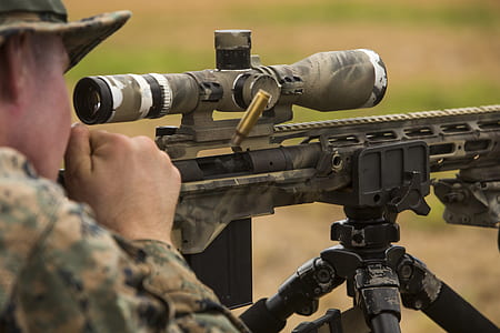 man scoping on sniper rifle thumbnail