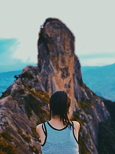 woman sitting mountain summit thumbnail