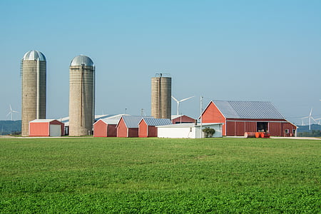 red barn houses at daytime thumbnail
