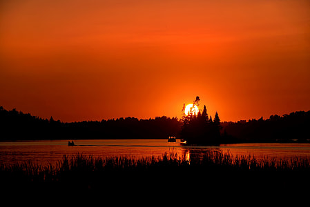 lake and trees during golden hour thumbnail
