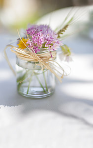 pink petaled flowers in glass jar filled with water thumbnail