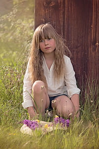 girl sitting under tree thumbnail