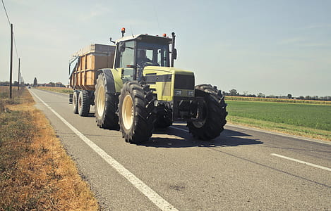 Yellow Tractor in Asphalt Road thumbnail