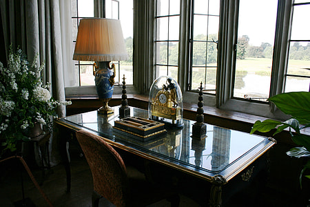 gold anniversary clock on top of glass-top table thumbnail