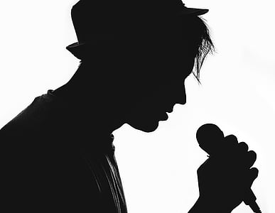 silhouette of man holding microphone thumbnail