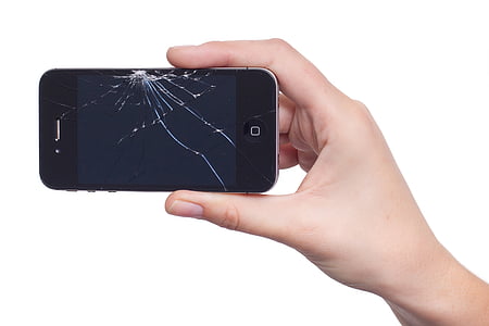 person holding cracked iPhone 4 thumbnail