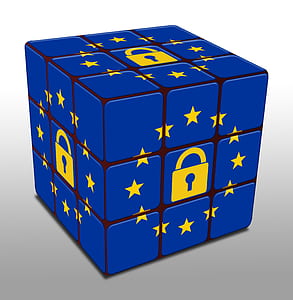 blue and yellow 3x3 Rubik's cube on white surface thumbnail