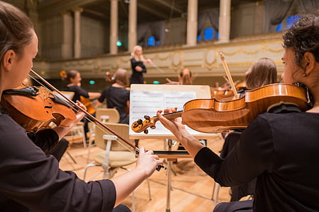 photograph of group of people playing violins thumbnail