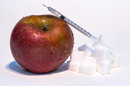 syringe on red apple thumbnail