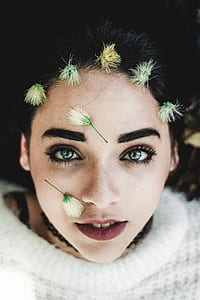 white flowers on woman's face thumbnail