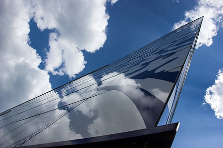 high-rise building under white clouds during daytime thumbnail