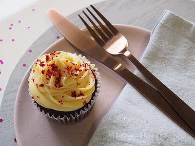 Silver Fork and Knife on Round Plate With Cupcake thumbnail