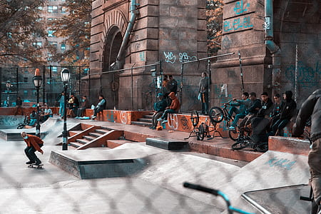 man riding on skateboard during daytime thumbnail