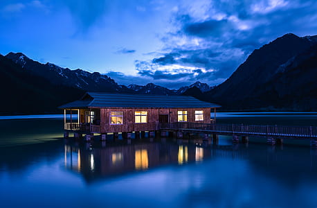 house in the middle of body of water thumbnail