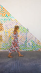 woman walking on concrete road thumbnail
