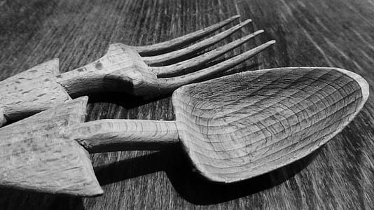grayscale photography of fork and spoon on surface thumbnail