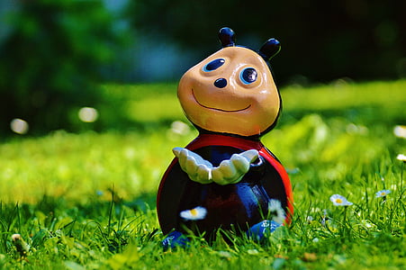 lady Bug figurine on green grass thumbnail
