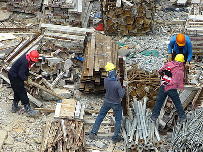 construction workers on yard carrying metal thumbnail