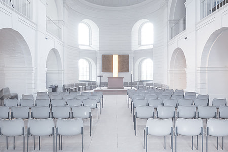 photography of white chairs in white concrete chapel thumbnail