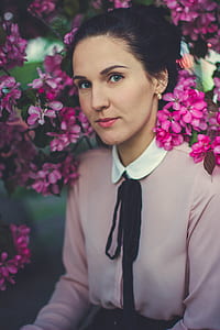 Woman Wearing Pink and White Collared Long Sleeve Dress Shirt Under Blooming Pink Petaled Flower thumbnail