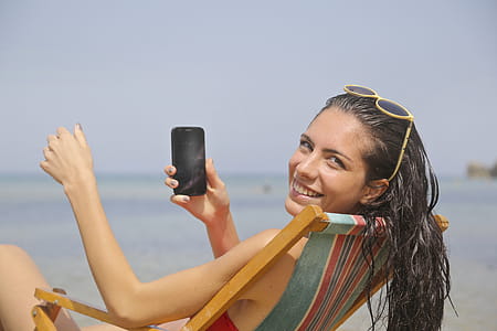 Woman Sitting On Sun Lounger thumbnail