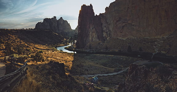 mountain and body of water under white sky thumbnail