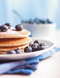 pancake with blueberries on white plate thumbnail