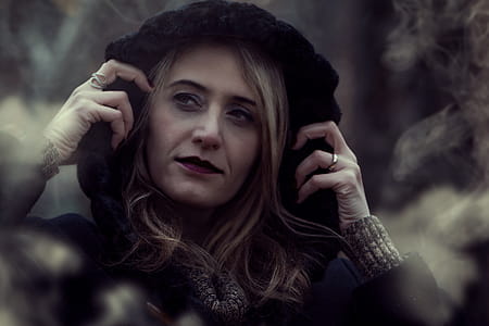 Close-up Photography of Woman Wearing Black Hooded Jacket thumbnail