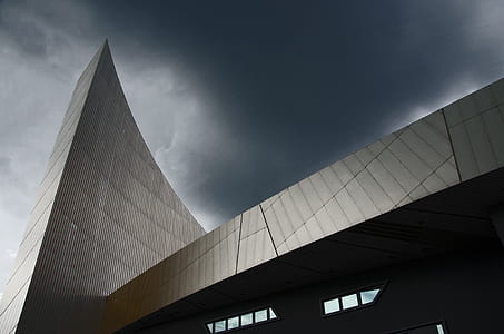 low angle photography of gray glass building thumbnail
