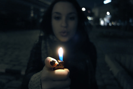 woman holding lighter thumbnail