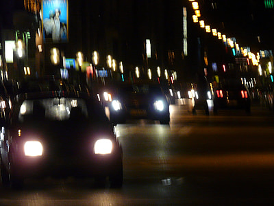 vehicles on road during nighttime thumbnail