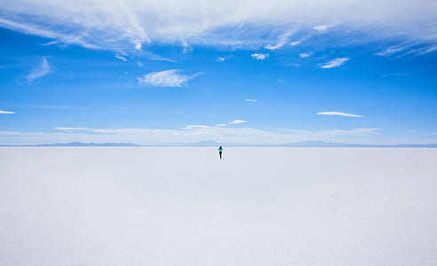 time lapse photography of person under white sky thumbnail