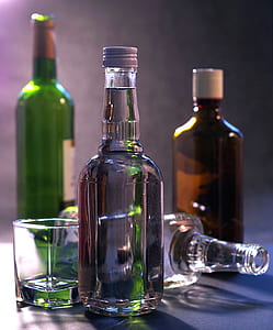 selective focus photography of glass bottle thumbnail