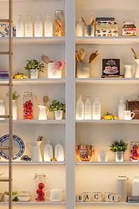 photo of white ceramic bottles on shelf thumbnail