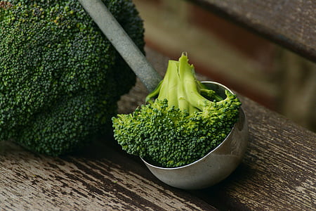 brocolli on a gray metal ladle thumbnail