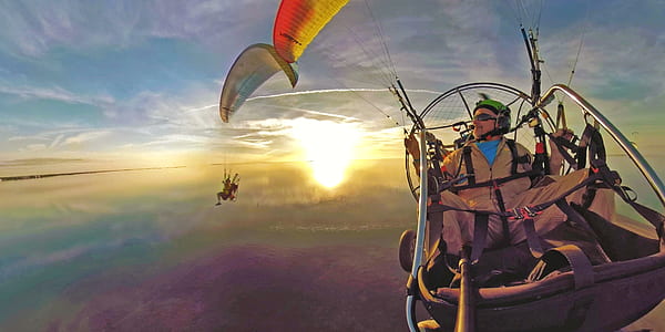 man paragliding in the sky thumbnail