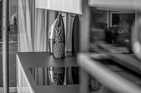 pineapple beside home appliance thumbnail