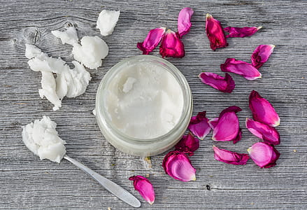clear glass jar with solidified powder and red petals thumbnail