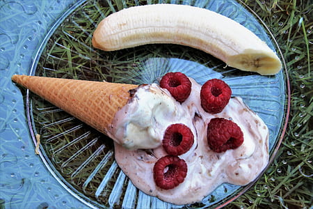 melted ice creams with berries and cone thumbnail