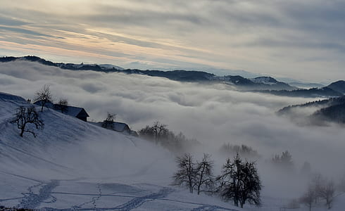 snowed mountain covered by white clouds thumbnail