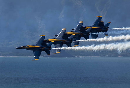five black-and-yellow jet plane doing air exhibition during daytime thumbnail