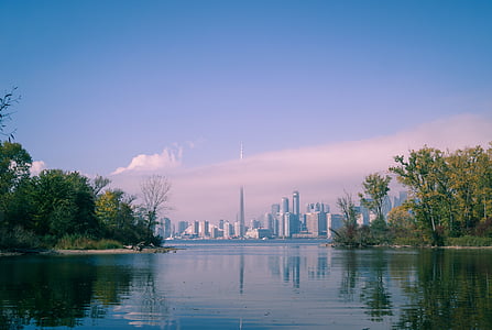view of city skyline from across body of water at daytime thumbnail