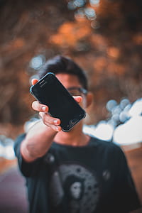 man holding black Samsung Galaxy Android smartphone thumbnail